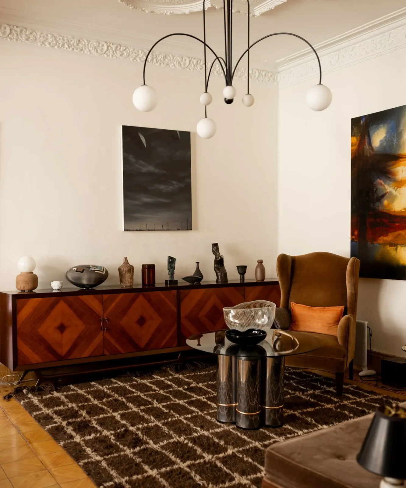 A curated collection of ceramics and vintage objects in the sitting room